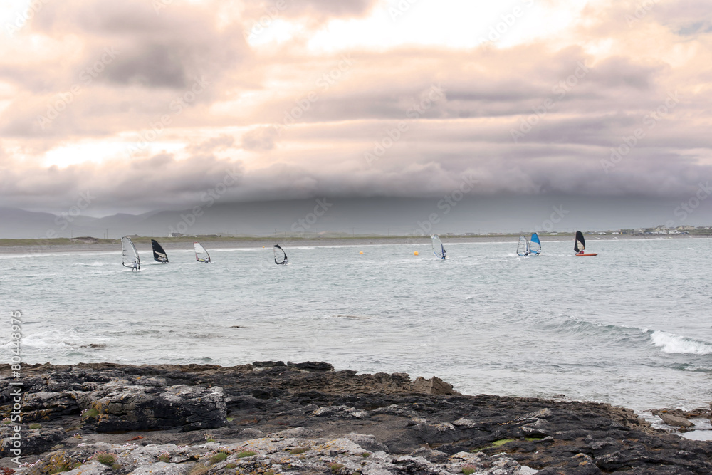 wind surfers racing in the storm