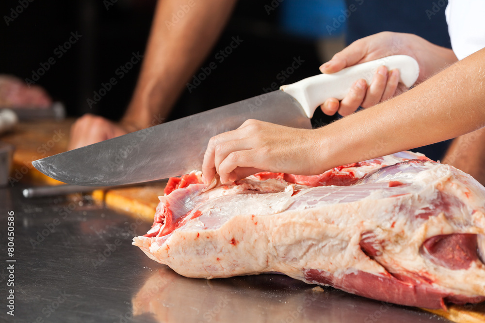 Confident Butchers Standing At Counter