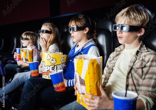 Shocked Siblings Watching 3D Movie In Theater