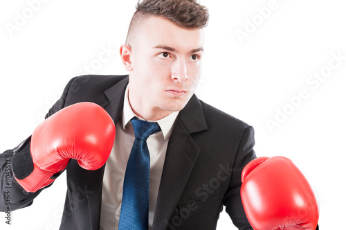 Young business man wearing boxing gloves © Catalin Pop