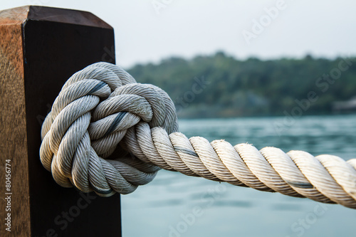 White rope tied into a knot.