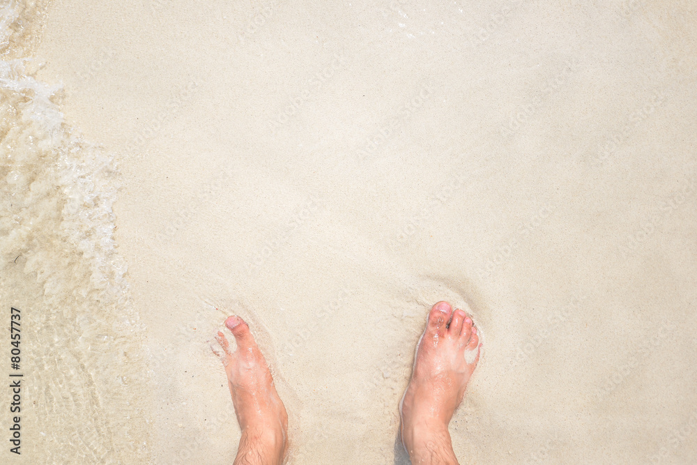 Feet over the beach