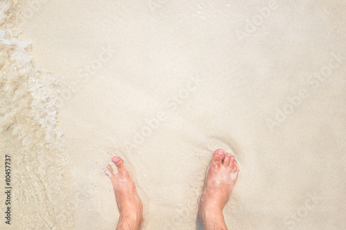 Feet over the beach