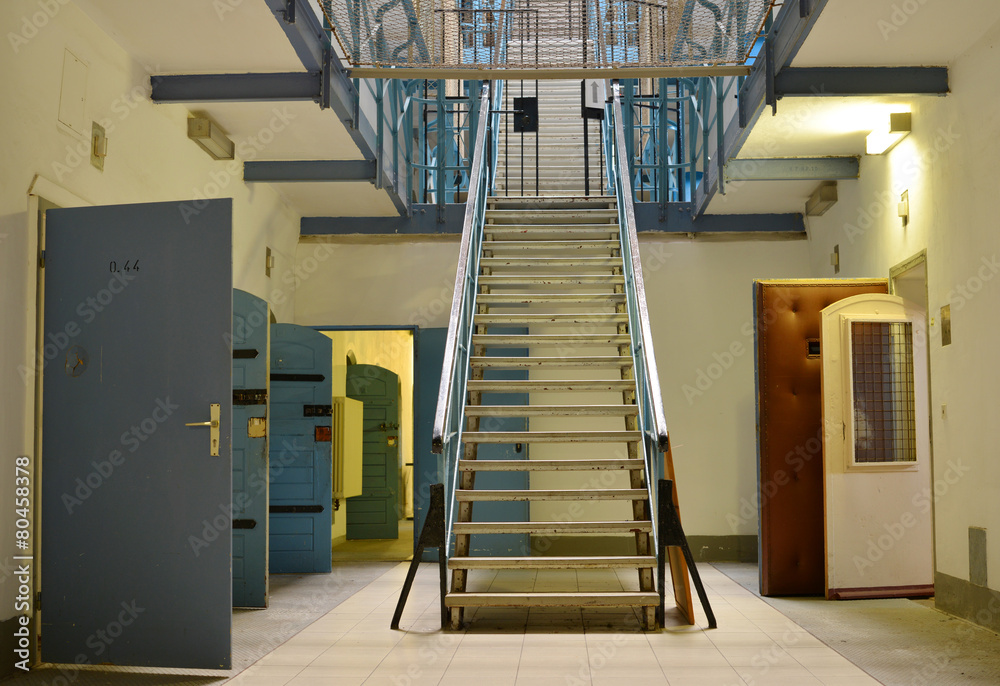 Inside an Jail with bars and secured doors - obrazy, fototapety, plakaty 
