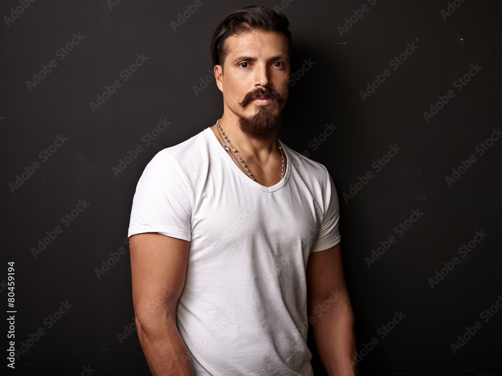 Portrait of a bearded man wearing white t-shirt Portrait of a bearded man wearing white t-shirt