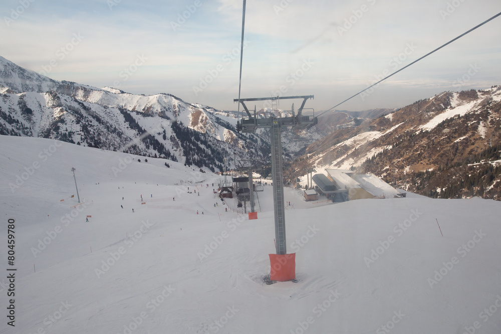 The cable car in the snowy mountains Chimbulak The cable car in the snowy mountains Chimbulak