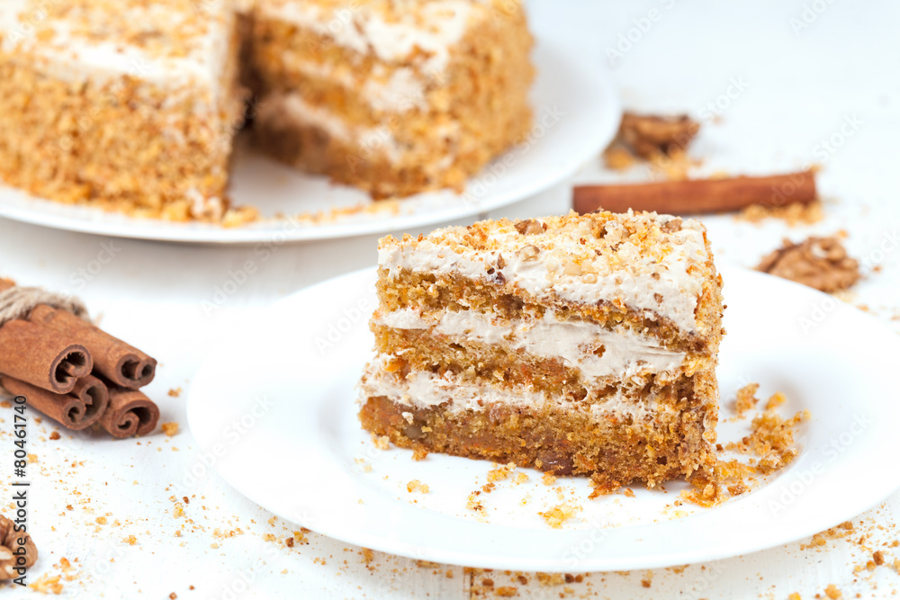 Slice of baked easter carrot cake with raisins and walnut Slice of baked easter carrot cake with raisins and walnut