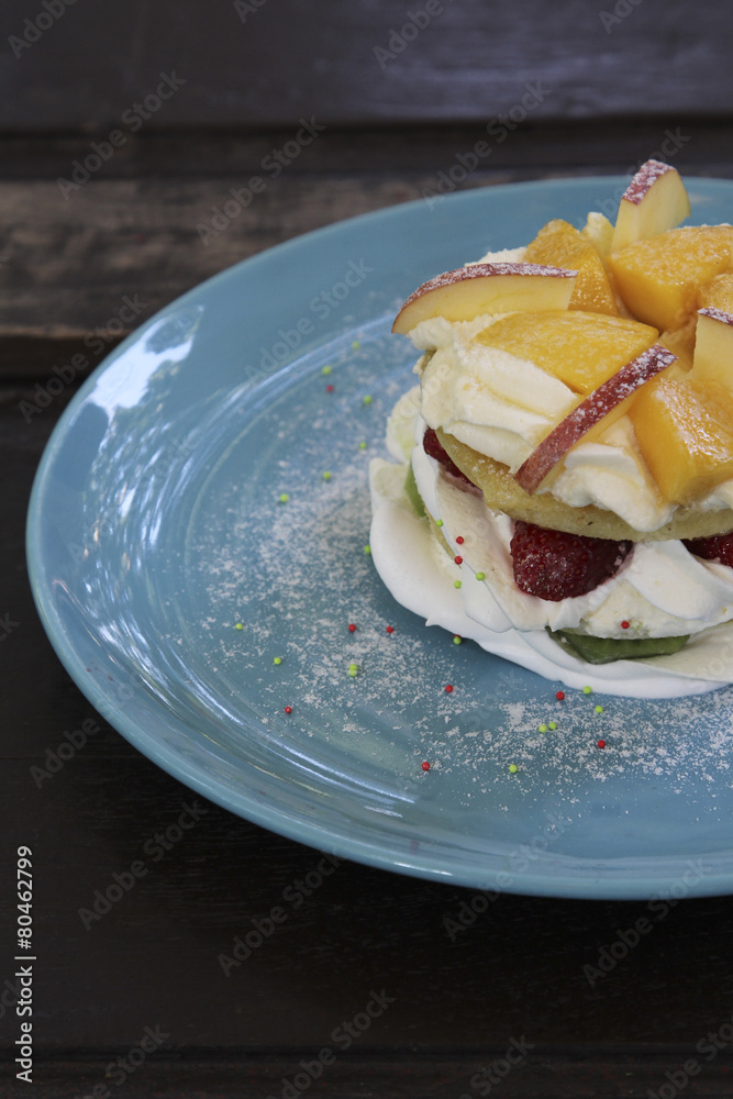 Mixed fruit pancakes on blue plate. Mixed fruit pancakes on blue plate.