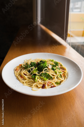 Spaghetti with broccoli and tomatoes.