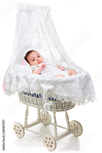 Cute baby girl in a carriage