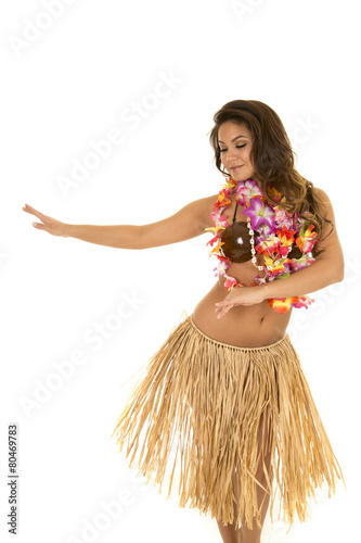 Hawaiian woman in grass skirt and coconut bra dancing Stock Photo
