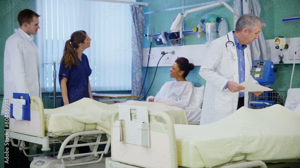 Medical staff working together and taking care of patients on a hospital ward