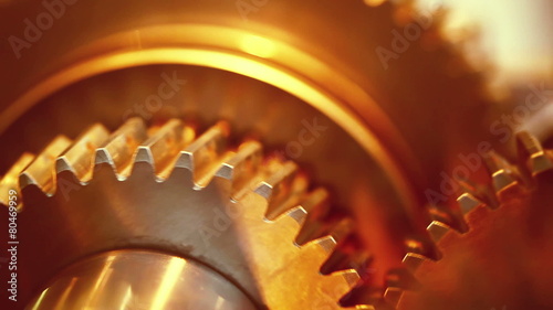 Golden gears with cogs in action. HD 1080p