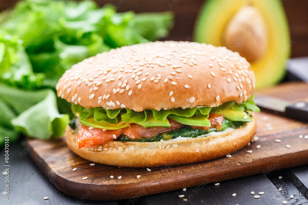 Burger with salmon and avocado Burger with salmon and avocado