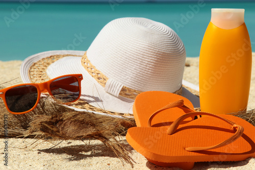 sun protection items and flip-flops photo