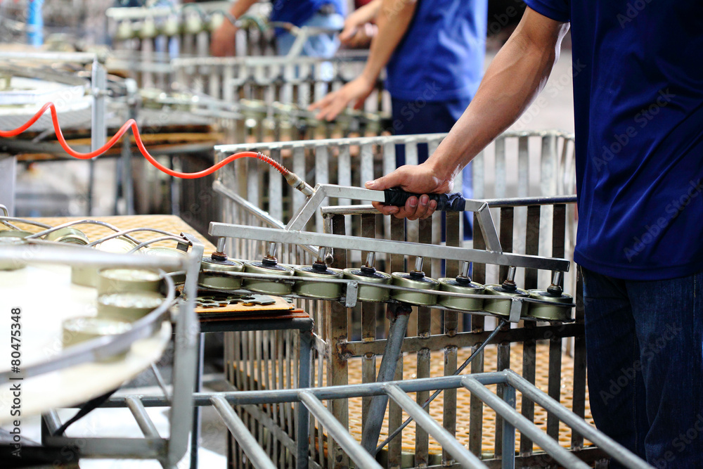 Tuna fish in can processing in factory, manufacturing