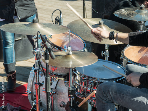 musical drums: hands with wooden sticks