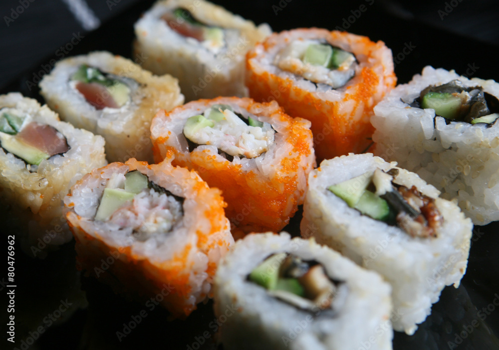 Japanese sushi on black plate Japanese sushi on black plate