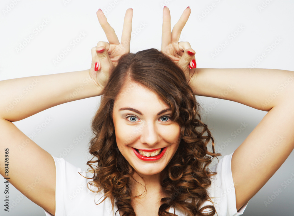 Fototapeta premium Funny woman doing hand sign