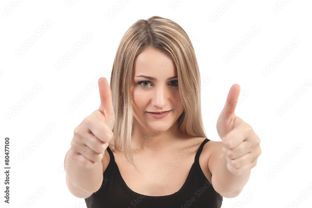 Fototapeta premium Close-up of a young woman showing thumbs up - Stock