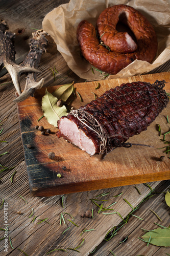 Smoked ham on a chopping board.