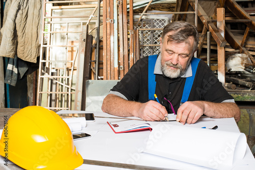 engineer at work, drawings, documents