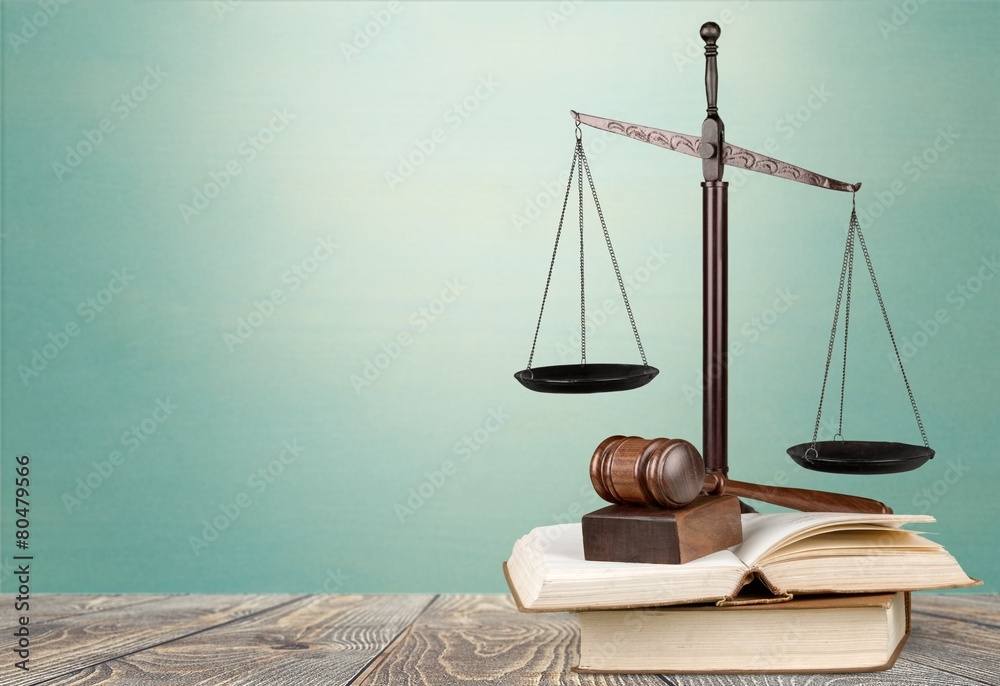 Law. Golden scales of justice, gavel and books isolated on white Law. Golden scales of justice, gavel and books isolated on white