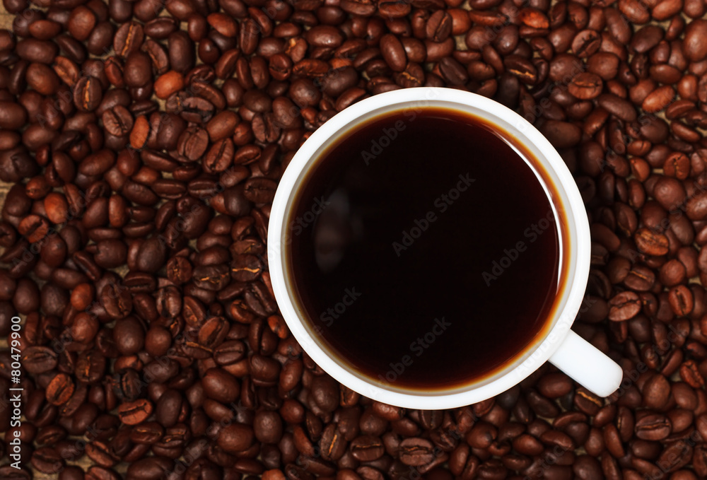 Coffee beans and a cup of coffee Coffee beans and a cup of coffee
