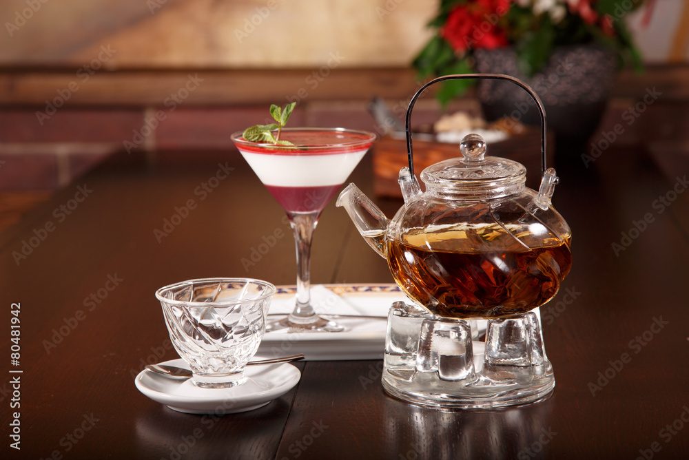 Transparent tea ceremony set on a wooden board