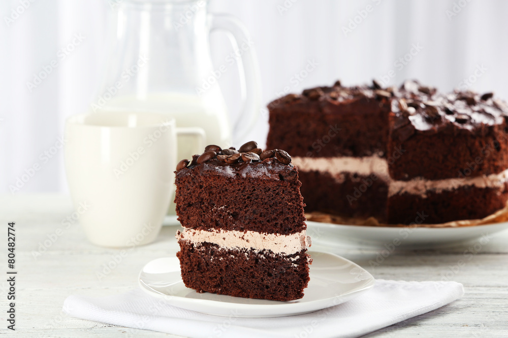 Delicious chocolate cake on table on light background Delicious chocolate cake on table on light background
