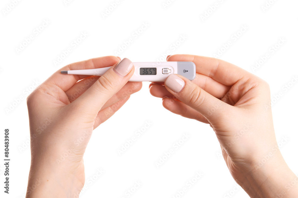 Female hands holding thermometer isolated on white Female hands holding thermometer isolated on white