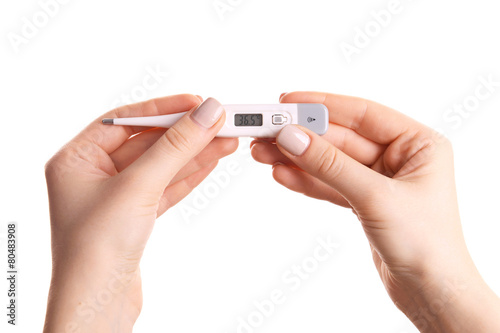 Female hands holding thermometer isolated on white