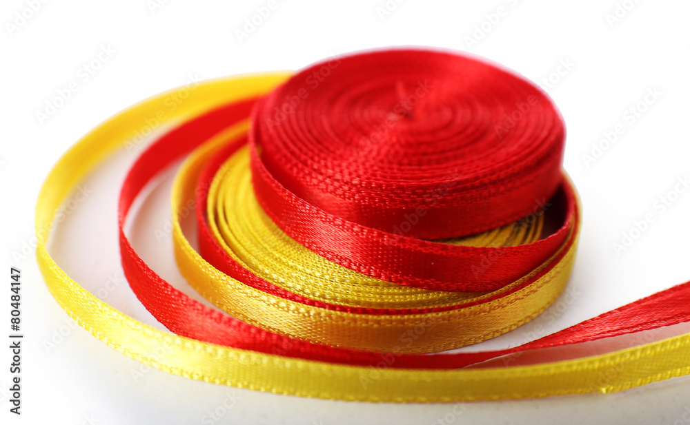 Colorful red and yellow ribbons isolated on white Colorful red and yellow ribbons isolated on white