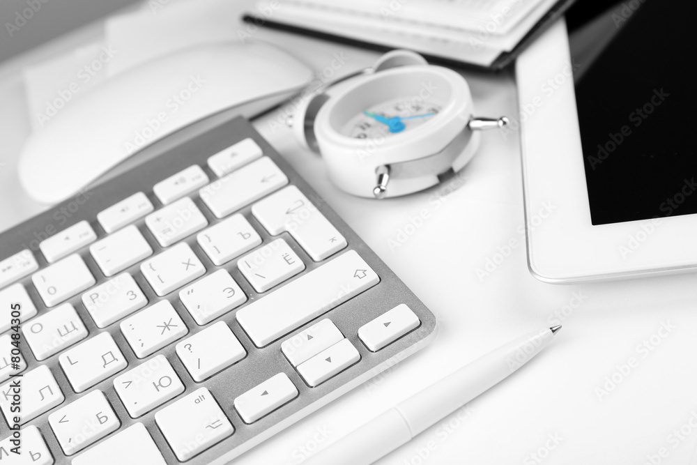 Office workplace with alarm clock close up Office workplace with alarm clock close up