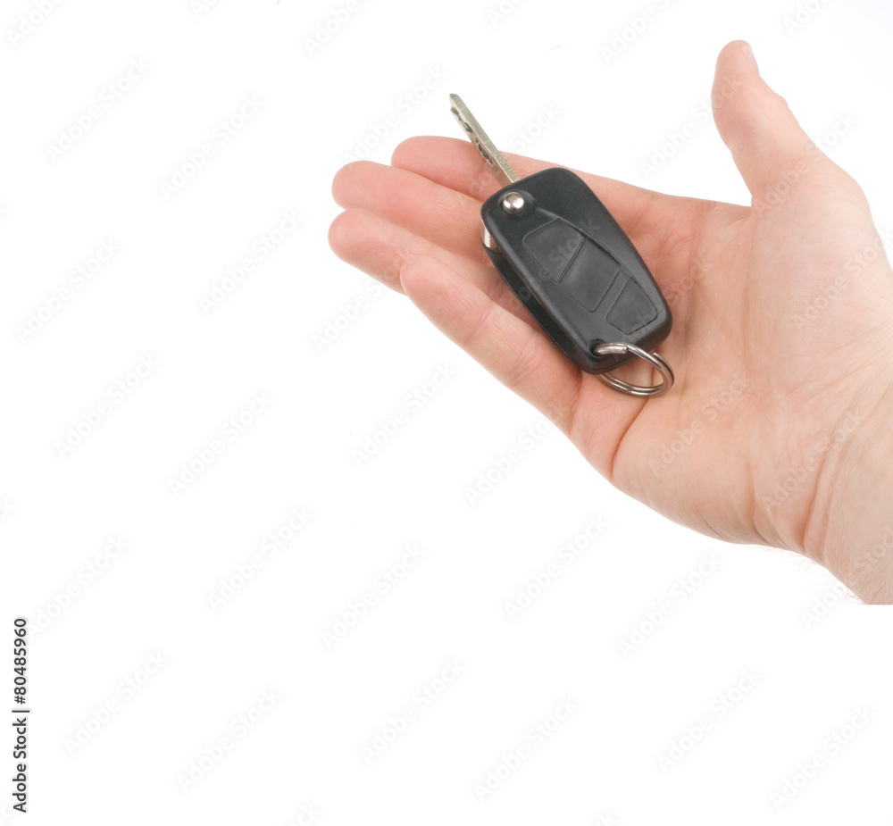 Hand holding car keys isolated on white background Hand holding car keys isolated on white background