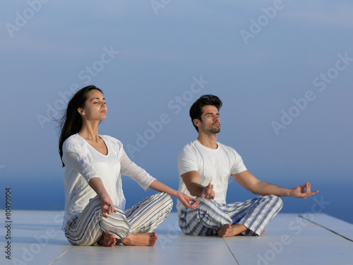 young couple practicing yoga © .shock