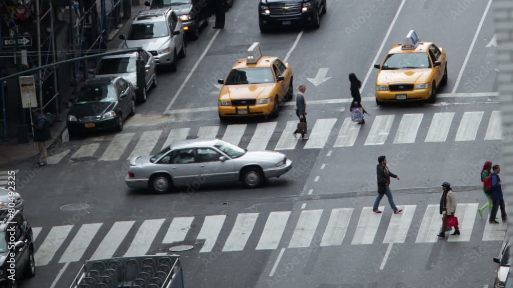 Time lapse of traffic congestion and pedestrians on a busy New York street