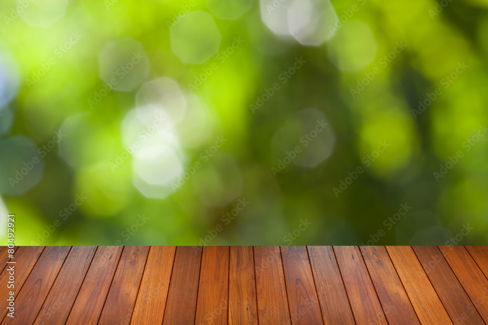 natural green bokeh background with wooden paving natural green bokeh background with wooden paving