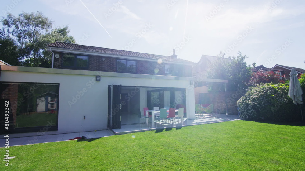 Exterior view of stylish modern home and garden in the summertime