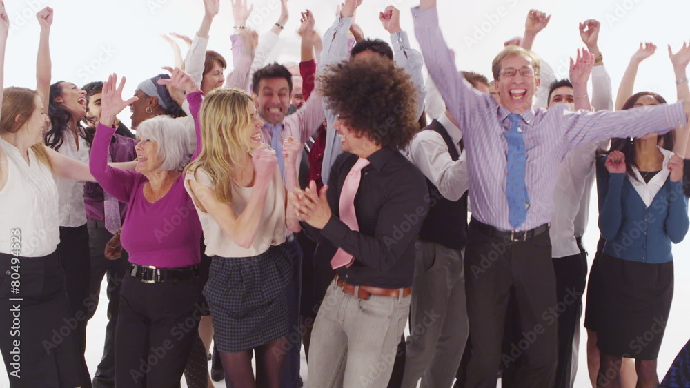 Happy mixed ethnicity group jumping for joy on white background in studio shot