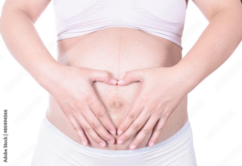 Loving couple with hands around pregnant belly Loving couple with hands around pregnant belly