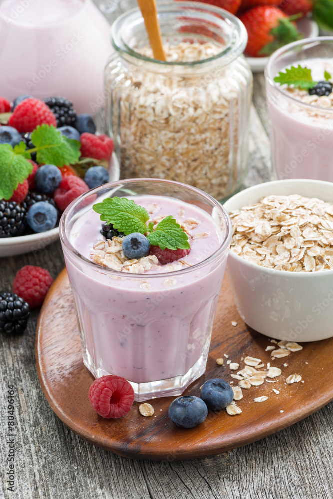 berry smoothie with oatmeal in a glass on table, vertical berry smoothie with oatmeal in a glass on table, vertical