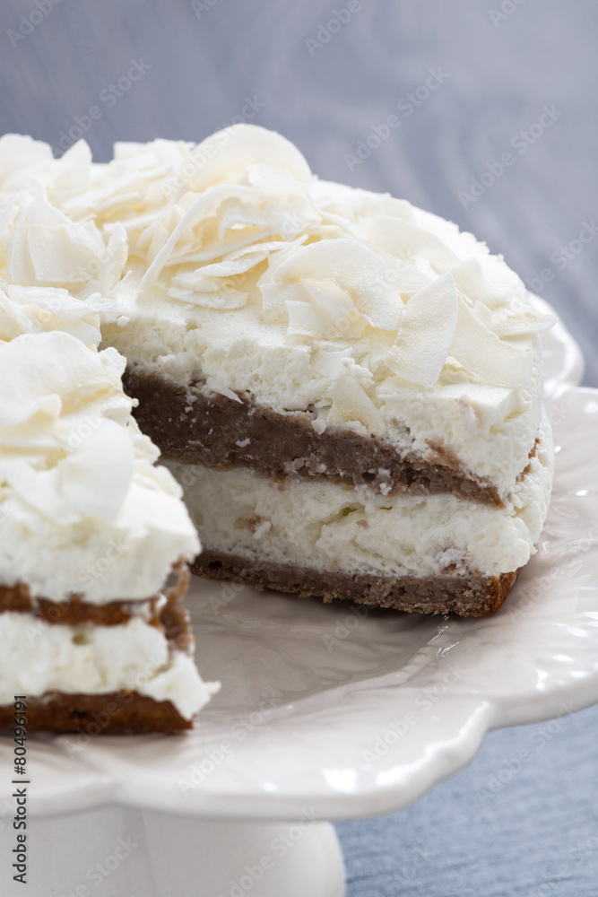 chocolate cake with coconut cream in a cut, vertical chocolate cake with coconut cream in a cut, vertical