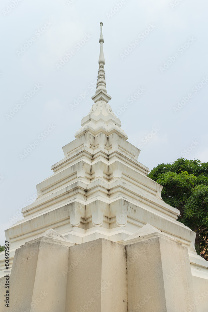 white stupa under the sun light at Wat Mai Pak Bang