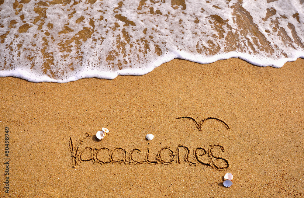 Fototapeta premium Vacations sign on the beach