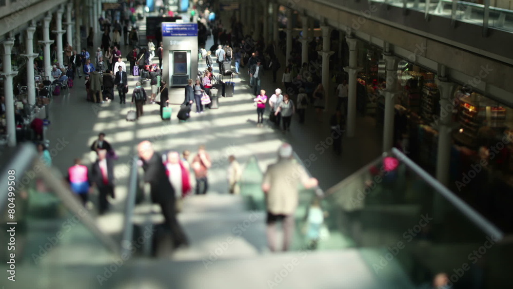 Time lapse of travelers and commuters passing through a London railway station