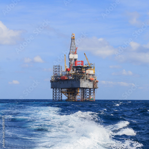 Offshore Jack Up Drilling Rig Over The Production Platform in Th © bomboman