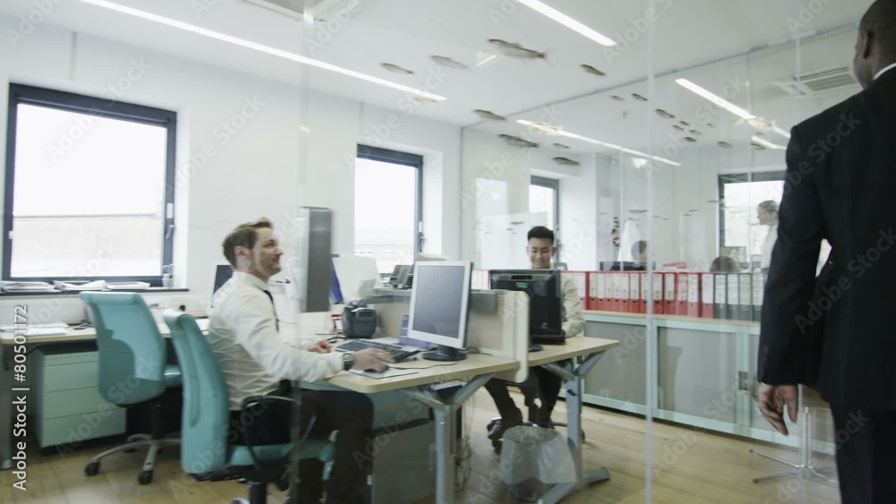 Young creative business team at work in a contemporary office Young creative business team at work in a contemporary office