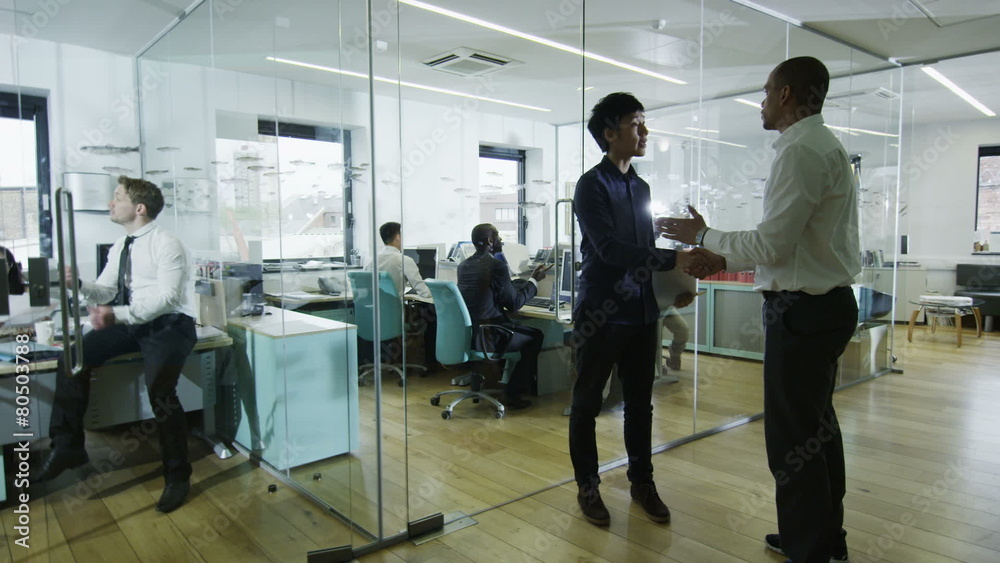 Young creative business team working together in a light contemporary office Young creative business team working together in a light contemporary office