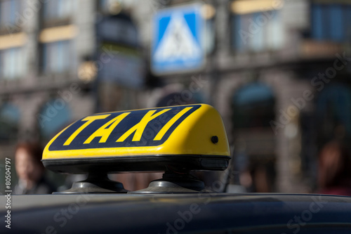 taxi cap on a car roof
